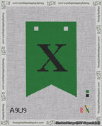 A taped needlepoint canvas with the design: Banner 18 mesh count Forked X Black on Green.