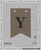 A taped needlepoint canvas with the design: Banner 18 mesh count Forked Y Black on Brown.