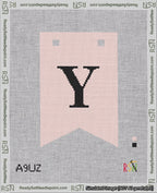 A taped needlepoint canvas with the design: Banner 18 mesh count Forked Y Black on Pink.