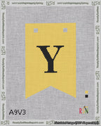 A taped needlepoint canvas with the design: Banner 18 mesh count Forked Y Black on Yellow.