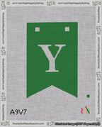 A taped needlepoint canvas with the design: Banner 18 mesh count Forked Y White on Green.