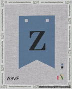 A taped needlepoint canvas with the design: Banner 18 mesh count Forked Z Black on Blue.