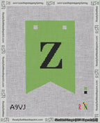 A taped needlepoint canvas with the design: Banner 18 mesh count Forked Z Black on Light Green.