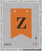 A taped needlepoint canvas with the design: Banner 18 mesh count Forked Z Black on Orange.