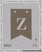 A taped needlepoint canvas with the design: Banner 18 mesh count Forked Z White on Brown.