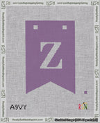 A taped needlepoint canvas with the design: Banner 18 mesh count Forked Z White on Purple.