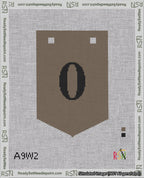 A taped needlepoint canvas with the design: Banner 18 mesh count Pointed 0 Black on Brown.