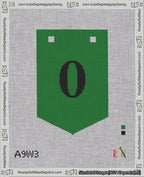 A taped needlepoint canvas with the design: Banner 18 mesh count Pointed 0 Black on Green.