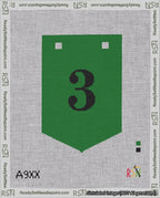 A taped needlepoint canvas with the design: Banner 18 mesh count Pointed 3 Black on Green.