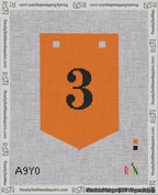 A taped needlepoint canvas with the design: Banner 18 mesh count Pointed 3 Black on Orange.