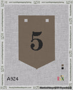 A taped needlepoint canvas with the design: Banner 18 mesh count Pointed 5 Black on Brown.