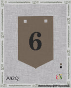 A taped needlepoint canvas with the design: Banner 18 mesh count Pointed 6 Black on Brown.