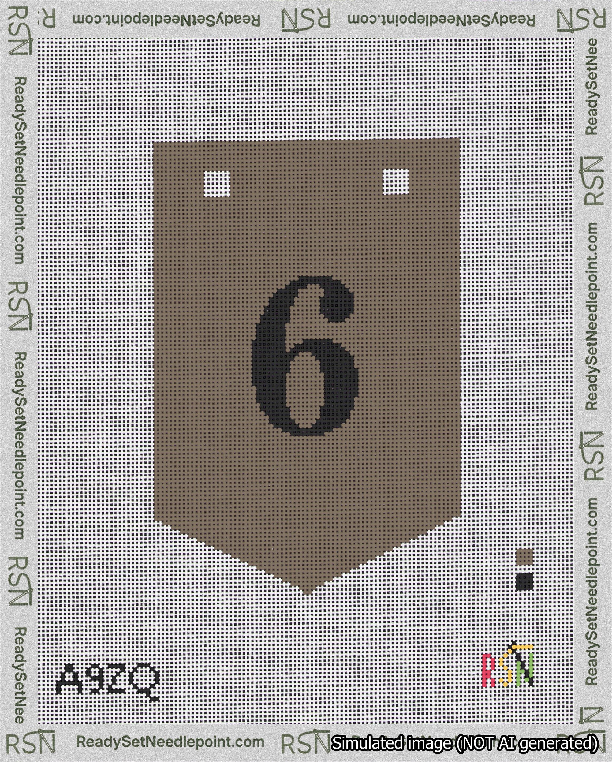 A taped needlepoint canvas with the design: Banner 18 mesh count Pointed 6 Black on Brown.