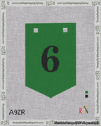 A taped needlepoint canvas with the design: Banner 18 mesh count Pointed 6 Black on Green.