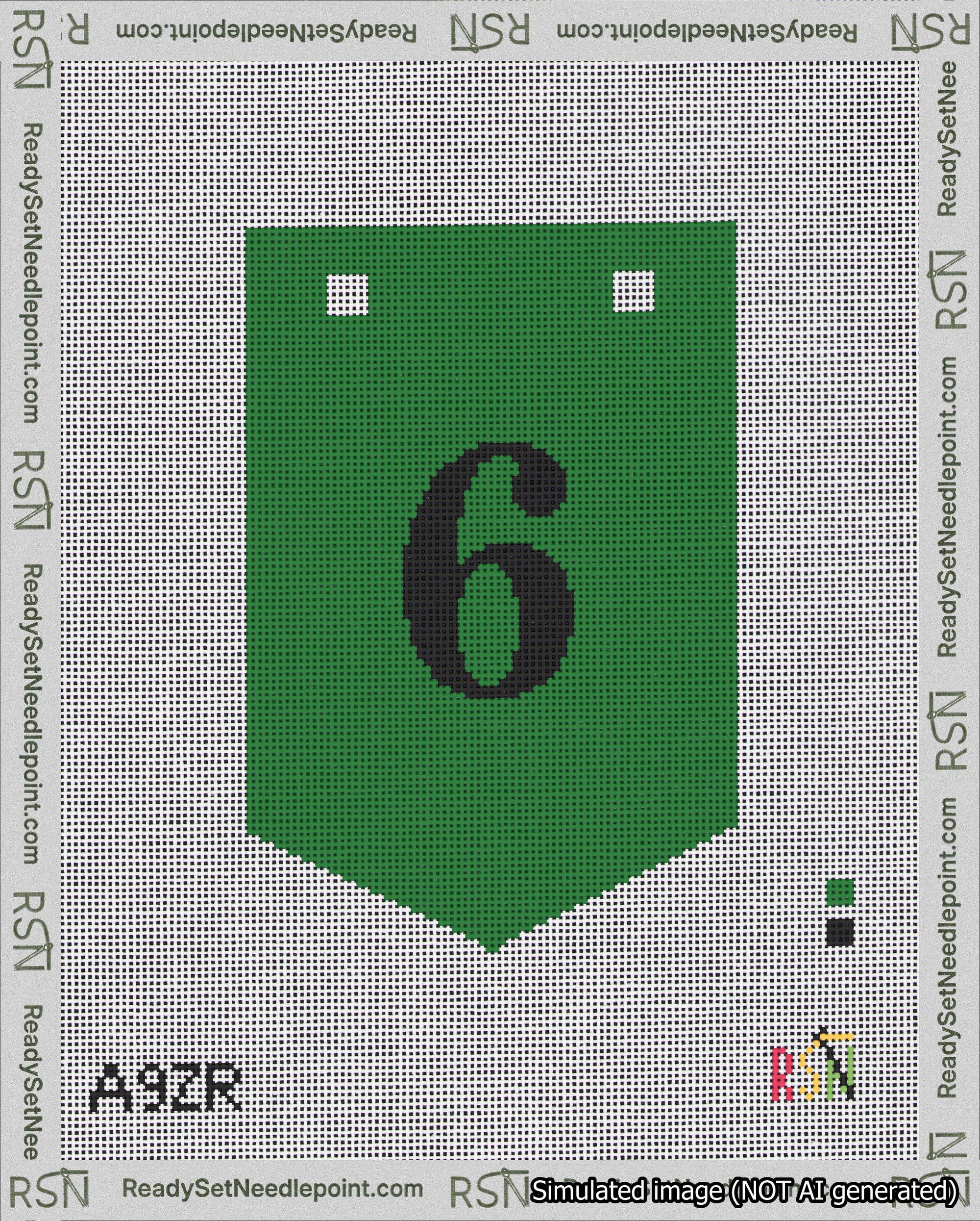 A taped needlepoint canvas with the design: Banner 18 mesh count Pointed 6 Black on Green.