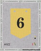 A taped needlepoint canvas with the design: Banner 18 mesh count Pointed 6 Black on Yellow.