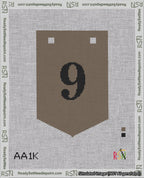 A taped needlepoint canvas with the design: Banner 18 mesh count Pointed 9 Black on Brown.