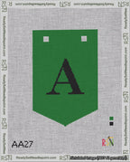 A taped needlepoint canvas with the design: Banner 18 mesh count Pointed A Black on Green.