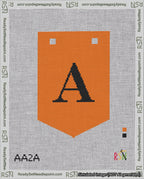 A taped needlepoint canvas with the design: Banner 18 mesh count Pointed A Black on Orange.