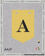 A taped needlepoint canvas with the design: Banner 18 mesh count Pointed A Black on Yellow.