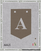 A taped needlepoint canvas with the design: Banner 18 mesh count Pointed A White on Brown.
