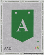 A taped needlepoint canvas with the design: Banner 18 mesh count Pointed A White on Green.