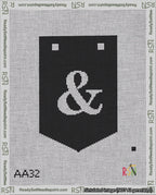 A taped needlepoint canvas with the design: Banner 18 mesh count Pointed Ampersand White on Black.