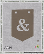A taped needlepoint canvas with the design: Banner 18 mesh count Pointed Ampersand White on Brown.