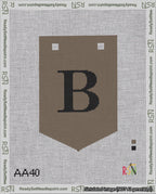 A taped needlepoint canvas with the design: Banner 18 mesh count Pointed B Black on Brown.
