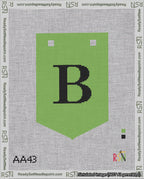 A taped needlepoint canvas with the design: Banner 18 mesh count Pointed B Black on Light Green.