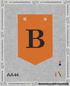 A taped needlepoint canvas with the design: Banner 18 mesh count Pointed B Black on Orange.