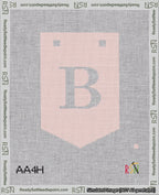 A taped needlepoint canvas with the design: Banner 18 mesh count Pointed B White on Pink.