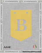 A taped needlepoint canvas with the design: Banner 18 mesh count Pointed B White on Yellow.