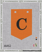 A taped needlepoint canvas with the design: Banner 18 mesh count Pointed C Black on Orange.