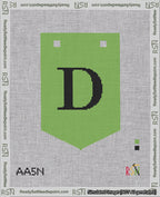 A taped needlepoint canvas with the design: Banner 18 mesh count Pointed D Black on Light Green.