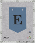 A taped needlepoint canvas with the design: Banner 18 mesh count Pointed E Black on Blue.