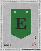 A taped needlepoint canvas with the design: Banner 18 mesh count Pointed E Black on Green.