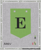 A taped needlepoint canvas with the design: Banner 18 mesh count Pointed E Black on Light Green.