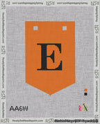 A taped needlepoint canvas with the design: Banner 18 mesh count Pointed E Black on Orange.