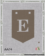 A taped needlepoint canvas with the design: Banner 18 mesh count Pointed E White on Brown.