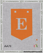 A taped needlepoint canvas with the design: Banner 18 mesh count Pointed E White on Orange.