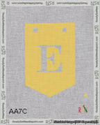 A taped needlepoint canvas with the design: Banner 18 mesh count Pointed E White on Yellow.