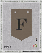 A taped needlepoint canvas with the design: Banner 18 mesh count Pointed F Black on Brown.