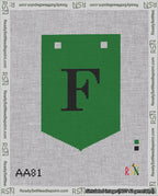 A taped needlepoint canvas with the design: Banner 18 mesh count Pointed F Black on Green.