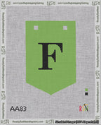 A taped needlepoint canvas with the design: Banner 18 mesh count Pointed F Black on Light Green.