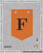 A taped needlepoint canvas with the design: Banner 18 mesh count Pointed F Black on Orange.