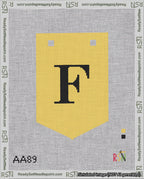 A taped needlepoint canvas with the design: Banner 18 mesh count Pointed F Black on Yellow.
