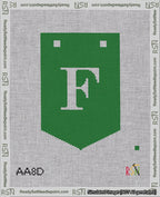 A taped needlepoint canvas with the design: Banner 18 mesh count Pointed F White on Green.