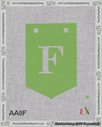 A taped needlepoint canvas with the design: Banner 18 mesh count Pointed F White on Light Green.