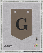 A taped needlepoint canvas with the design: Banner 18 mesh count Pointed G Black on Brown.